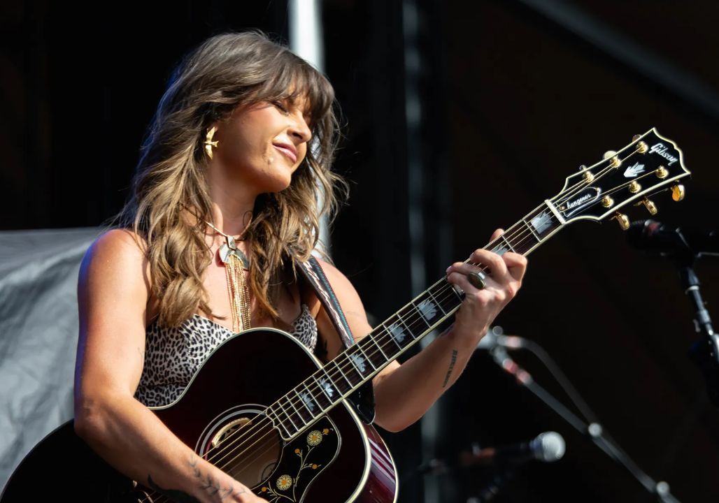 “Netflix has confirmed a 16-episode limited series, Ella Langley: Strings and Stories, chronicling the raw and rising journey of one of country music’s most compelling new voices. Directed and narrated by Langley herself, the show will trace her path from small-town Southern roots to national recognition — a story of grit, honesty, heartbreak, and the fearless storytelling that defines modern country music. “This story isn’t just about success or the spotlight,” Langley said. “It’s about truth — the late nights, the broken hearts, the strength it takes to keep singing when no one’s listening.””